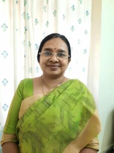 a woman in a green and yellow sari